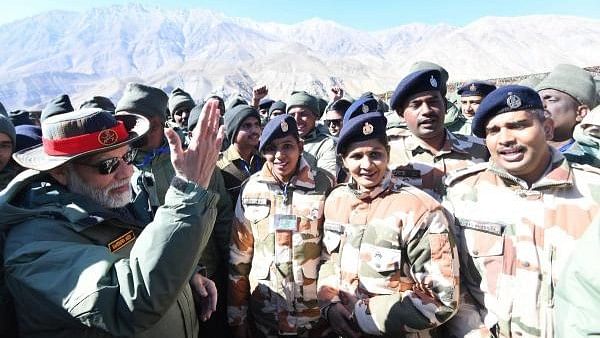 <div class="paragraphs"><p> Prime Minister Narendra Modi during Diwali festival celebrations with Armed Forces personnel, in Kargil in 2022.</p></div>