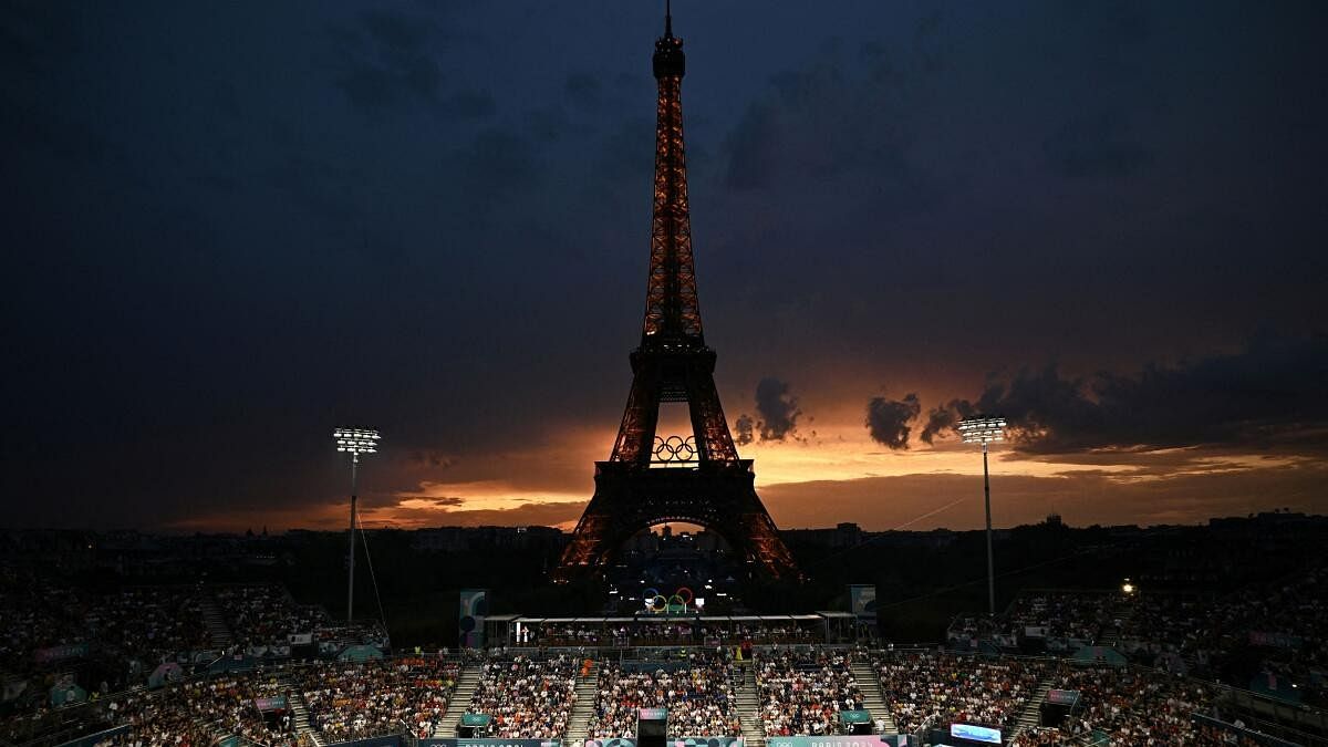 <div class="paragraphs"><p>General view of the Eiffel Tower Stadium shows the Eiffel Tower with the Olympic rings at dusk.</p></div>