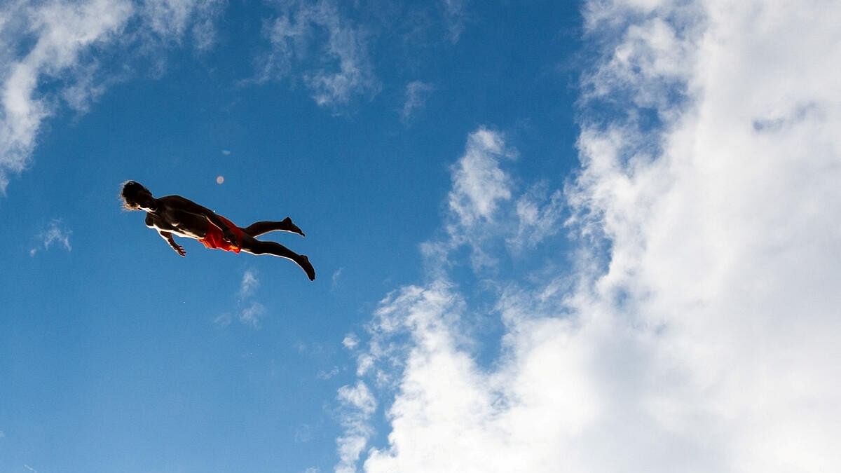 <div class="paragraphs"><p>A competitor jumps into the water during a cliff diving competition near the Central Bohemian village of Hrimezdice, Czech Republic, August 3, 2024.</p></div>