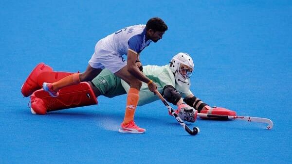 <div class="paragraphs"><p>Paris 2024 Olympics - Hockey - Men's Quarter-final - India vs Great Britain - Yves-du-Manoir Stadium, Colombes, France - August 4, 2024. India's Raj Kumar Pal scores the winning penalty during the penalty shootout.</p></div>