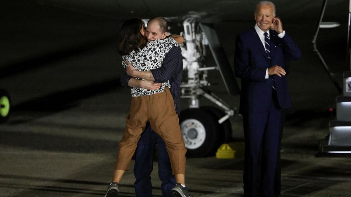 <div class="paragraphs"><p>US President Joe Biden looks on as Evan Gershkovich who was released from detention in Russia, is greeted by his mother Ella Milman, upon his arrival at Joint Base Andrews in Maryland, US.</p></div>