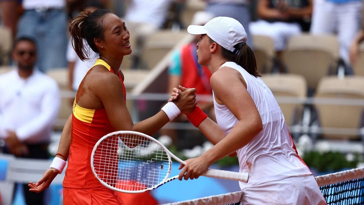 <div class="paragraphs"><p>Qinwen Zheng (L) of China and Iga Swiatek of Poland shake hands after their match.</p></div>