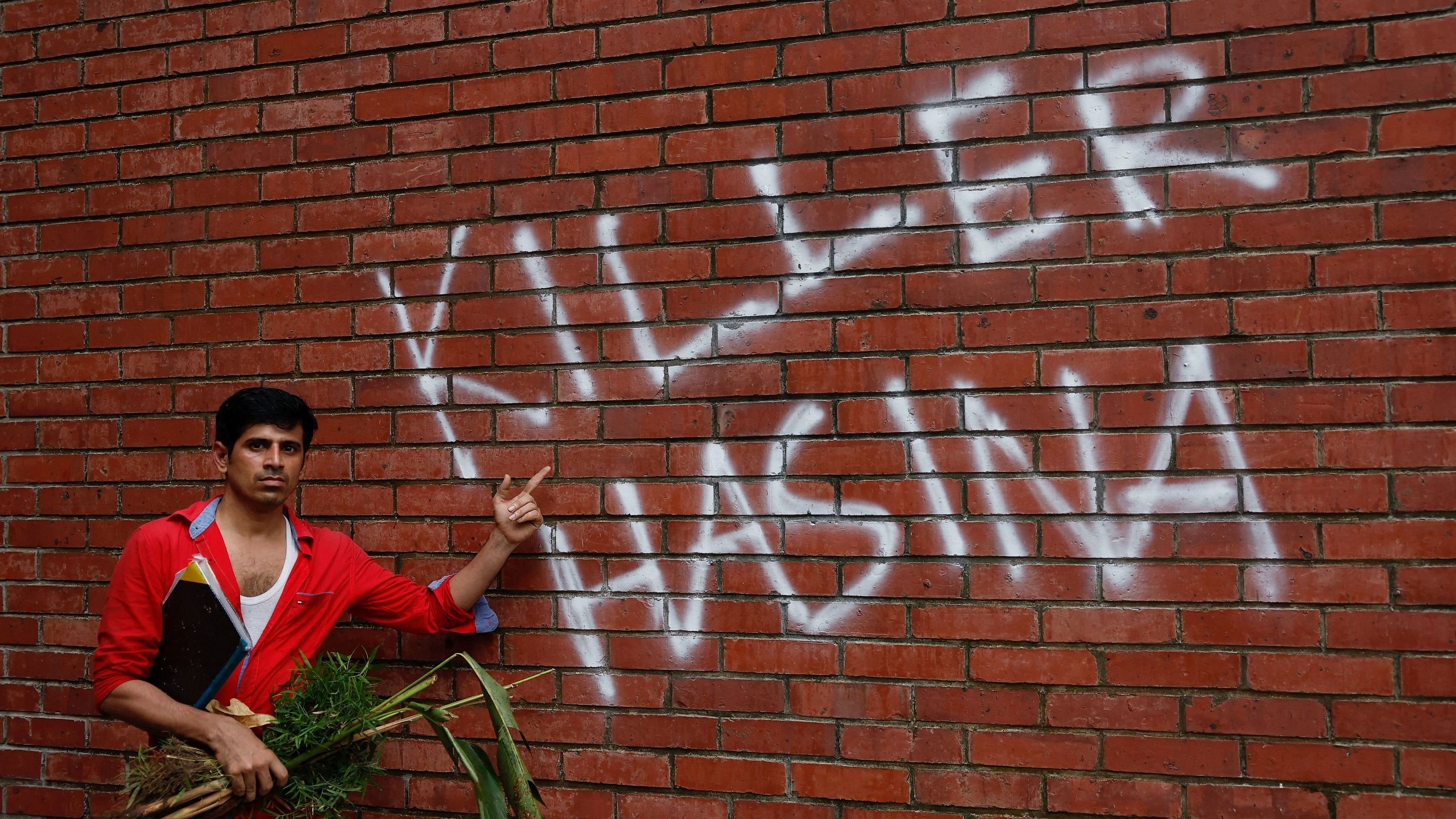 <div class="paragraphs"><p>A man poses at the Ganabhaban, the Prime Minister's residence, after the resignation Prime Minister Sheikh Hasina in Dhaka, Bangladesh, August 5, 2024. </p></div>