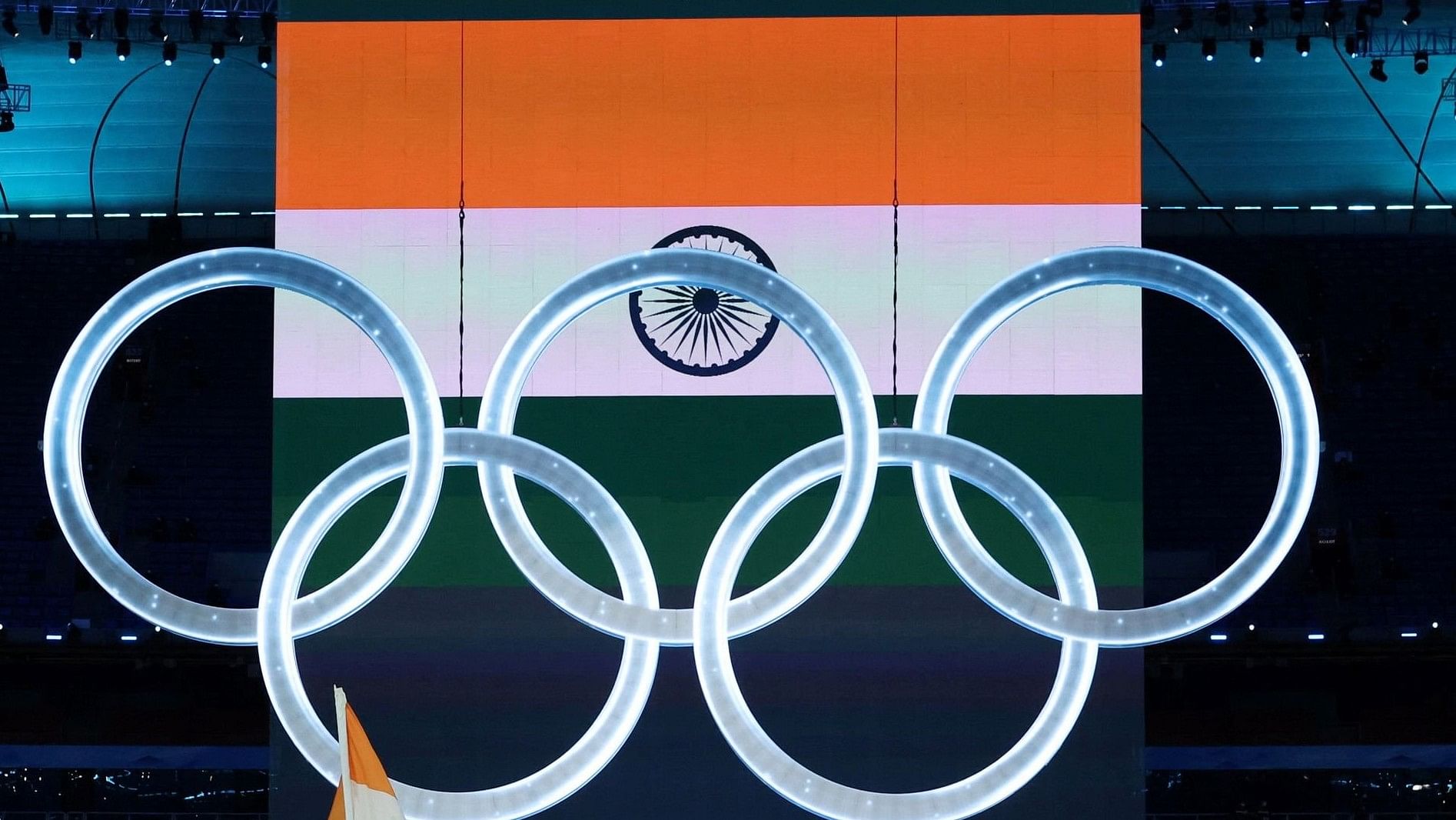 <div class="paragraphs"><p>Indian flag behind the Olympics logo.</p></div>