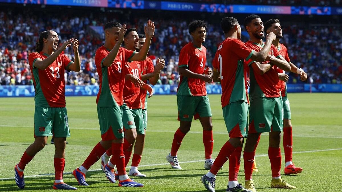 <div class="paragraphs"><p>Mehdi Maouhoub of Morocco celebrates scoring their fourth with teammates.</p></div>