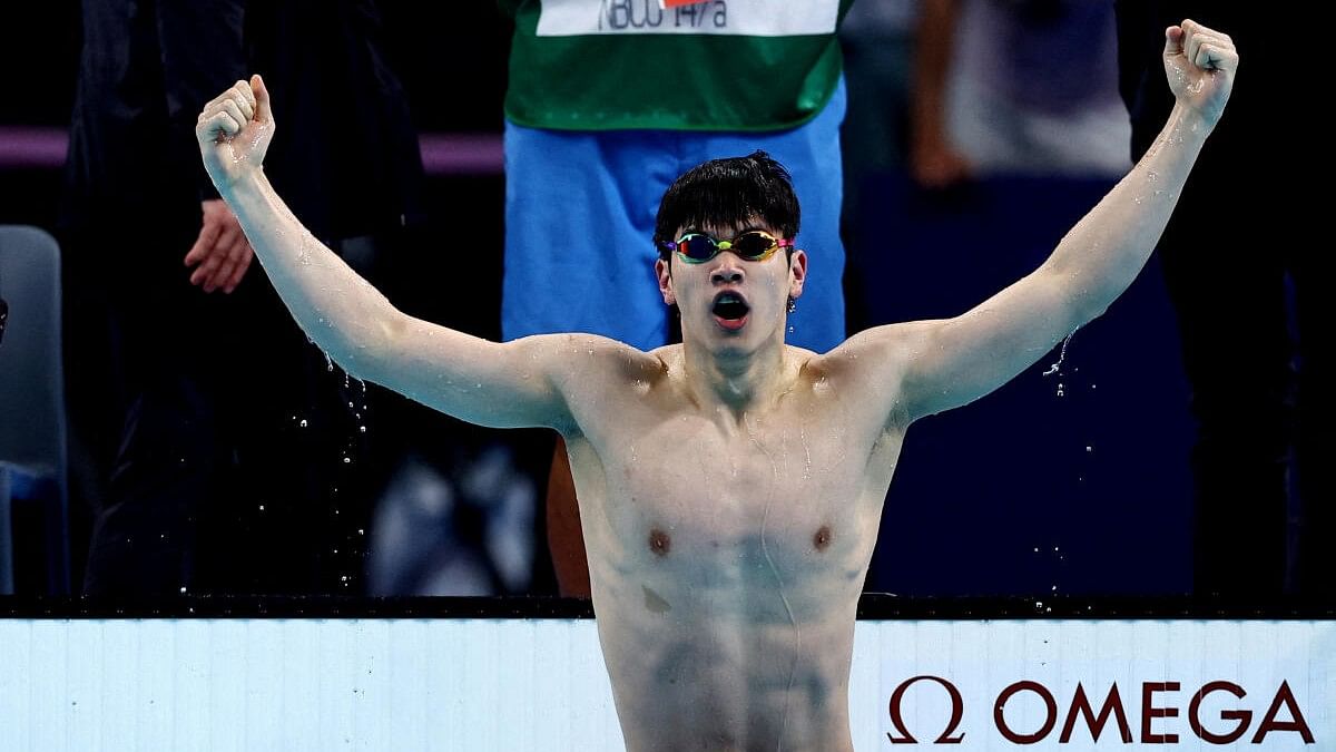 <div class="paragraphs"><p>Zhanle Pan of China reacts after winning the race and establishing World record.</p></div>