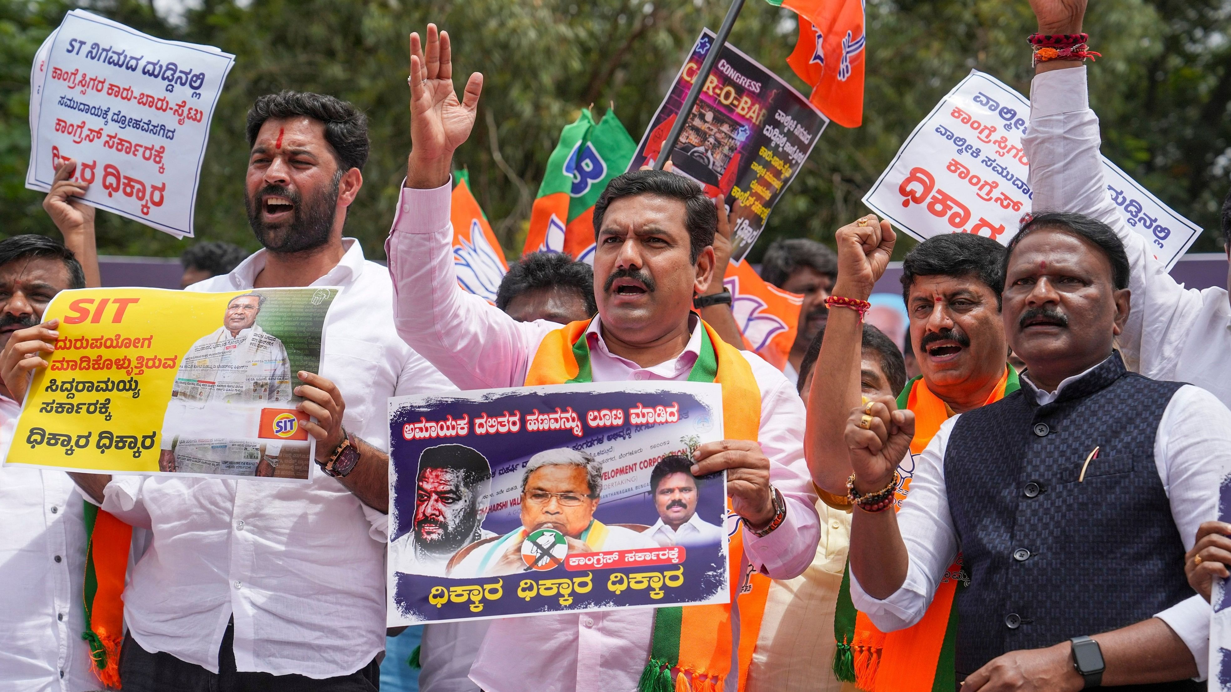 <div class="paragraphs"><p>Karnataka BJP President B Y Vijayendra with other party leaders and workers during a protest demanding the resignation of Chief Minister Siddaramaiah over the alleged scam in the Karnataka Maharshi Valmiki Scheduled Tribes Development Corporation Ltd., in Bengaluru.</p></div>