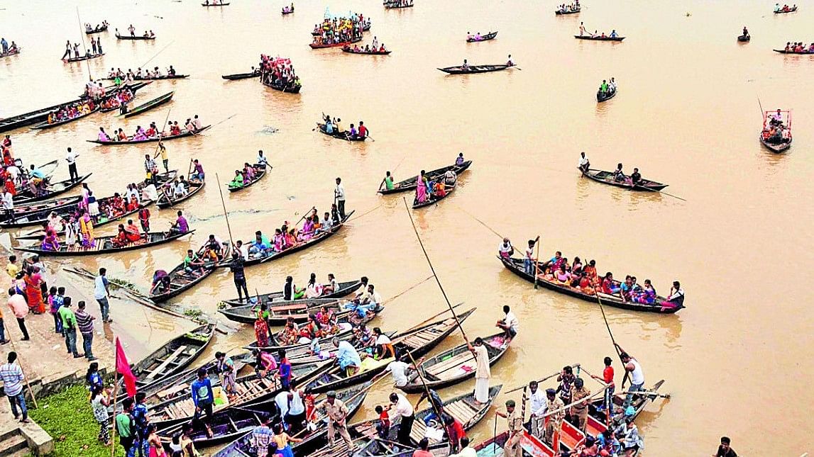 <div class="paragraphs"><p>File Photo: People row their boats during the traditional annual boat race festival at Rudra Sagar Lake in Melaghar, 55 kms southeast of Agartala.</p></div>