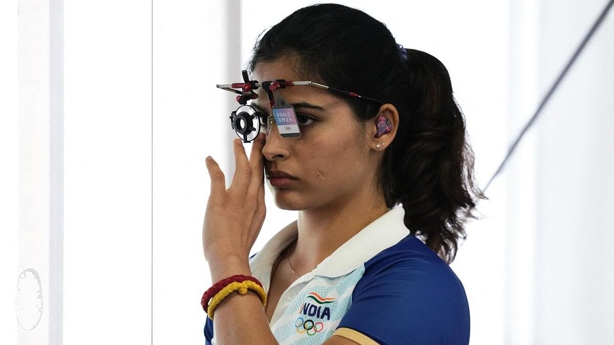 <div class="paragraphs"><p>Manu Bhaker adjusts her eyepiece during the qualification round.&nbsp;</p></div>