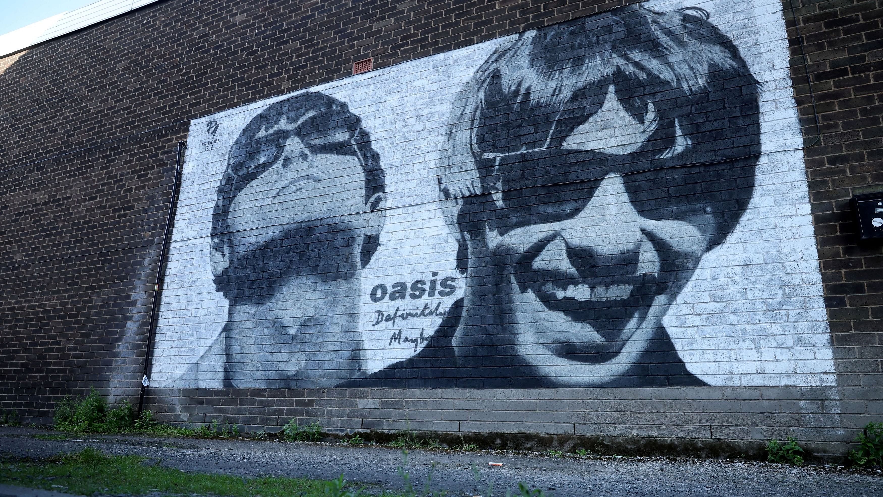 <div class="paragraphs"><p>A view of a mural of Oasis band members Liam and Noel Gallagher </p></div>