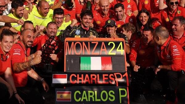 <div class="paragraphs"><p>Ferrari's Charles Leclerc celebrates with his team after winning the Italian Grand Prix</p></div>