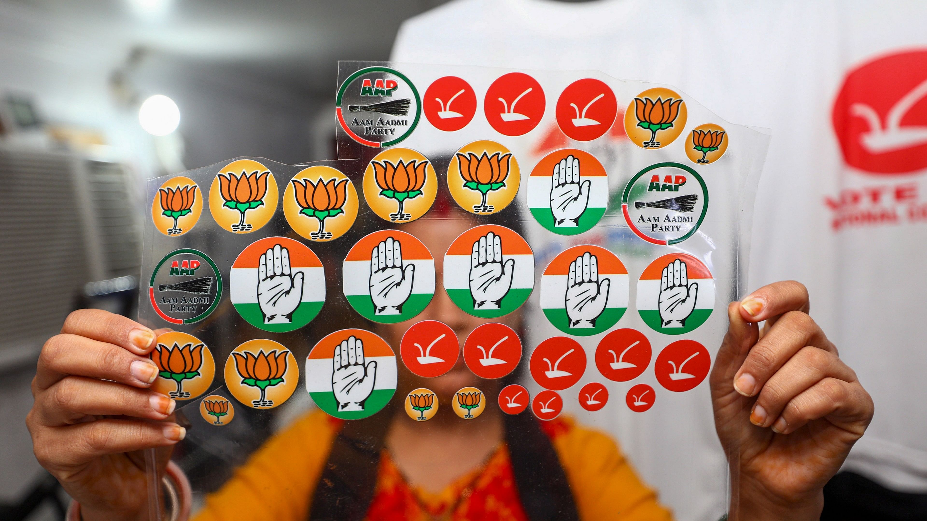 <div class="paragraphs"><p>A shopkeeper shows stickers of different political parties’ logos being sold at a photography shop ahead of the upcoming Assembly elections, in Jammu, Thursday, Aug. 29, 2024.</p></div>