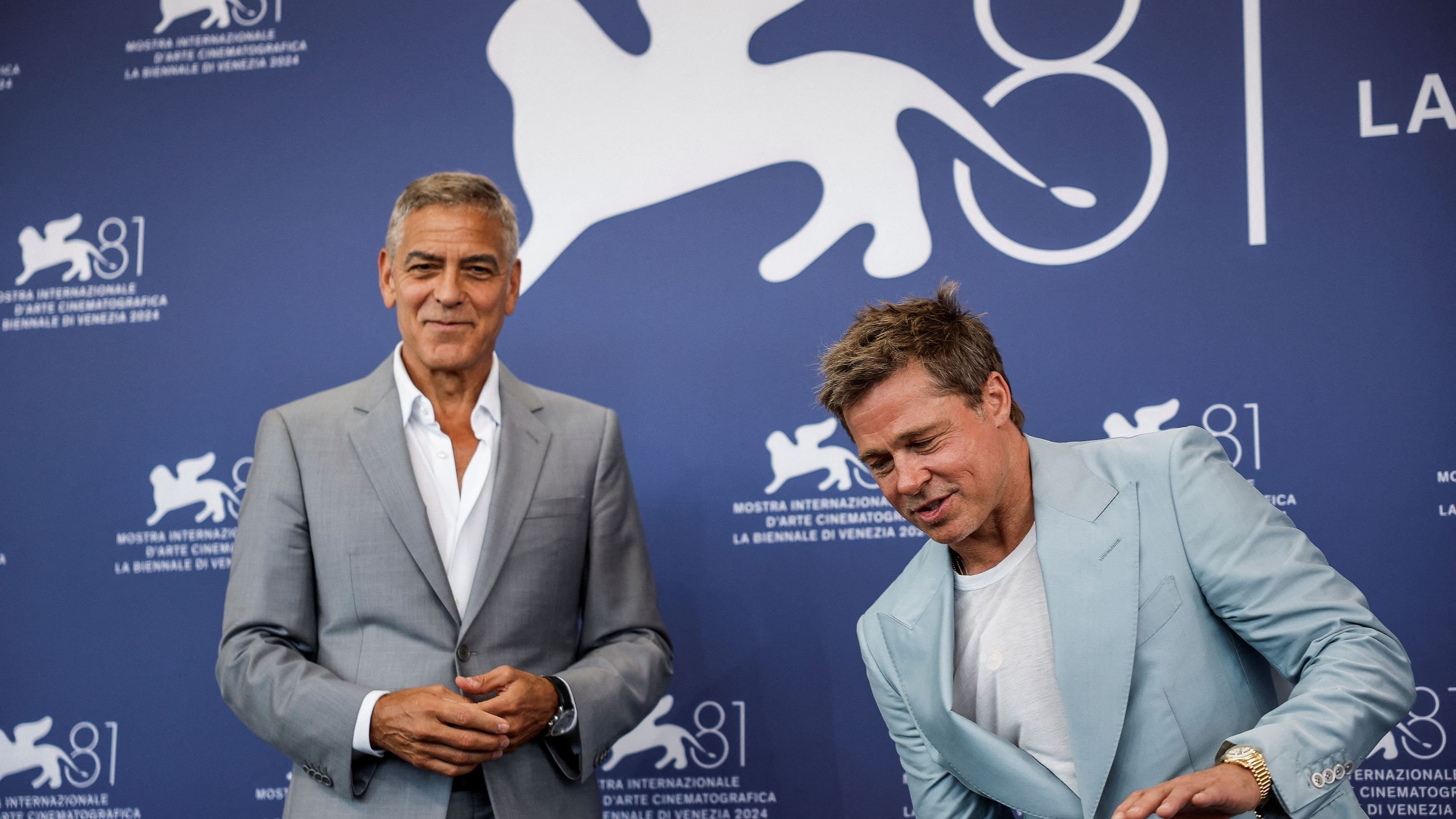 <div class="paragraphs"><p> Brad Pitt and George Clooney pose during a photocall for the movie "The Wolfs".</p></div>