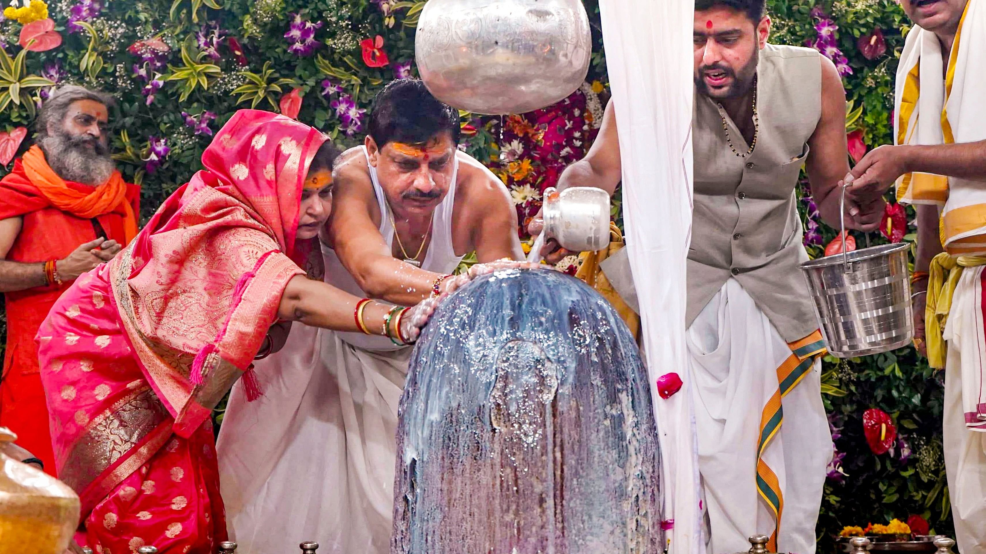 <div class="paragraphs"><p>Madhya Pradesh Chief Minister Mohan Yadav with his wife Seema Yadav offers prayers at the Mahakaleshwar temple, in Ujjain, Monday, Sept. 2, 2024. </p></div>