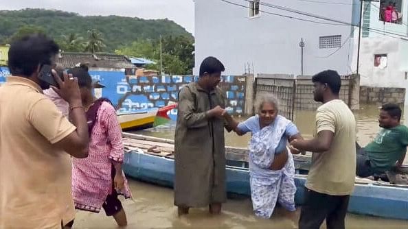 <div class="paragraphs"><p>Evacuation and relief work under way in flood-hit Andhra Pradesh. </p></div>