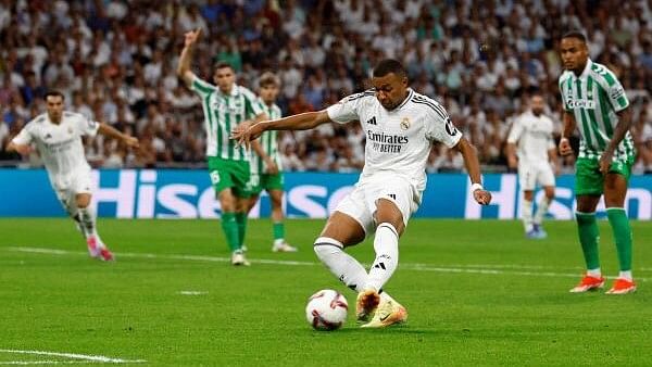 <div class="paragraphs"><p>Real Madrid's Kylian Mbappe scores their first goal.</p></div>