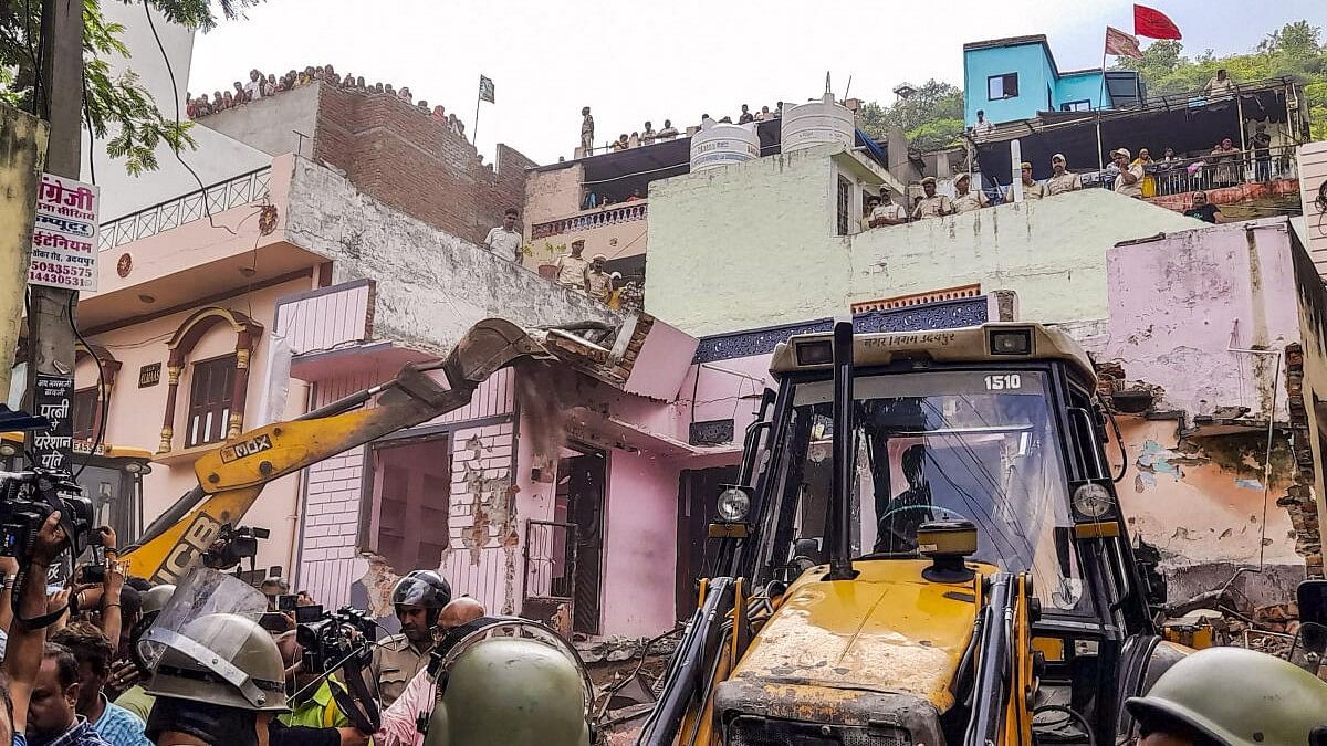 <div class="paragraphs"><p>House of an accused student, who allegedly stabbed his classmate at a government school, being bulldozed, in Udaipur, Saturday, Aug. 17, 2024. </p></div>