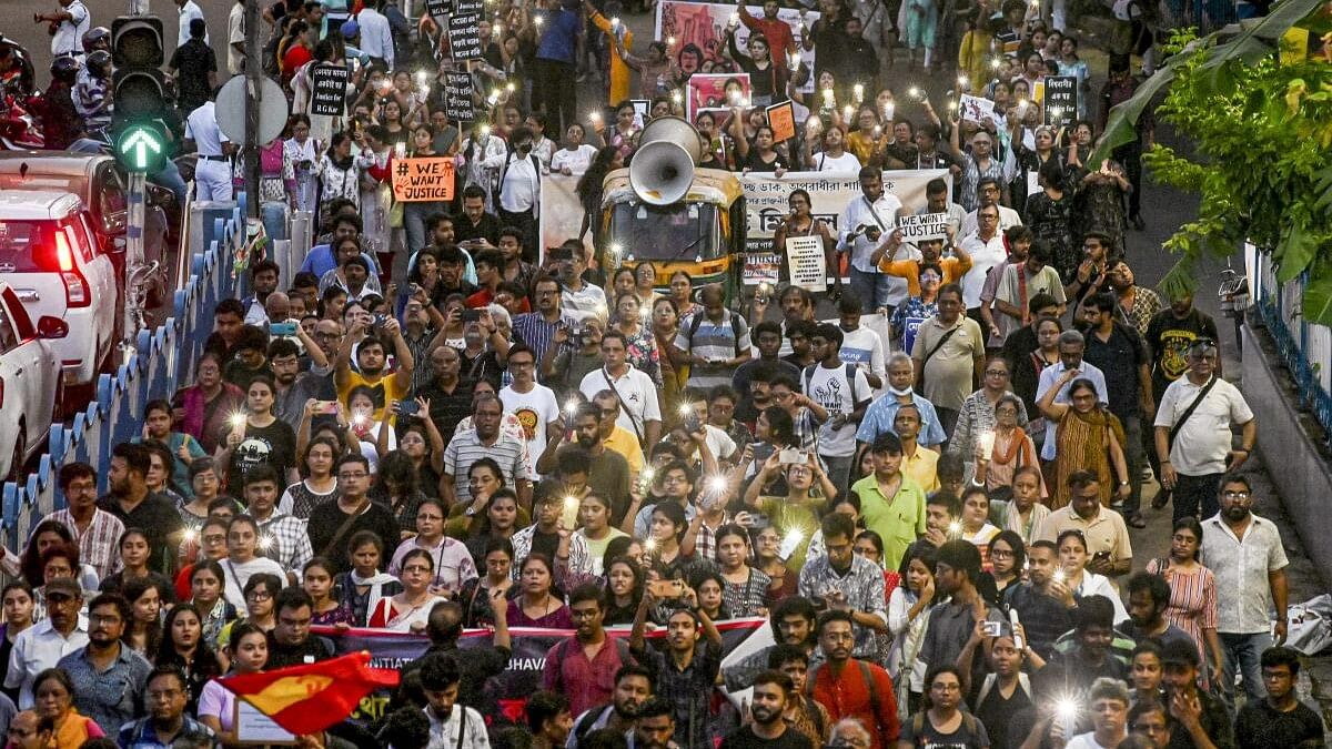 <div class="paragraphs"><p>People take part in a protest march against the alleged sexual assault and murder of a trainee doctor, in Kolkata.</p></div>