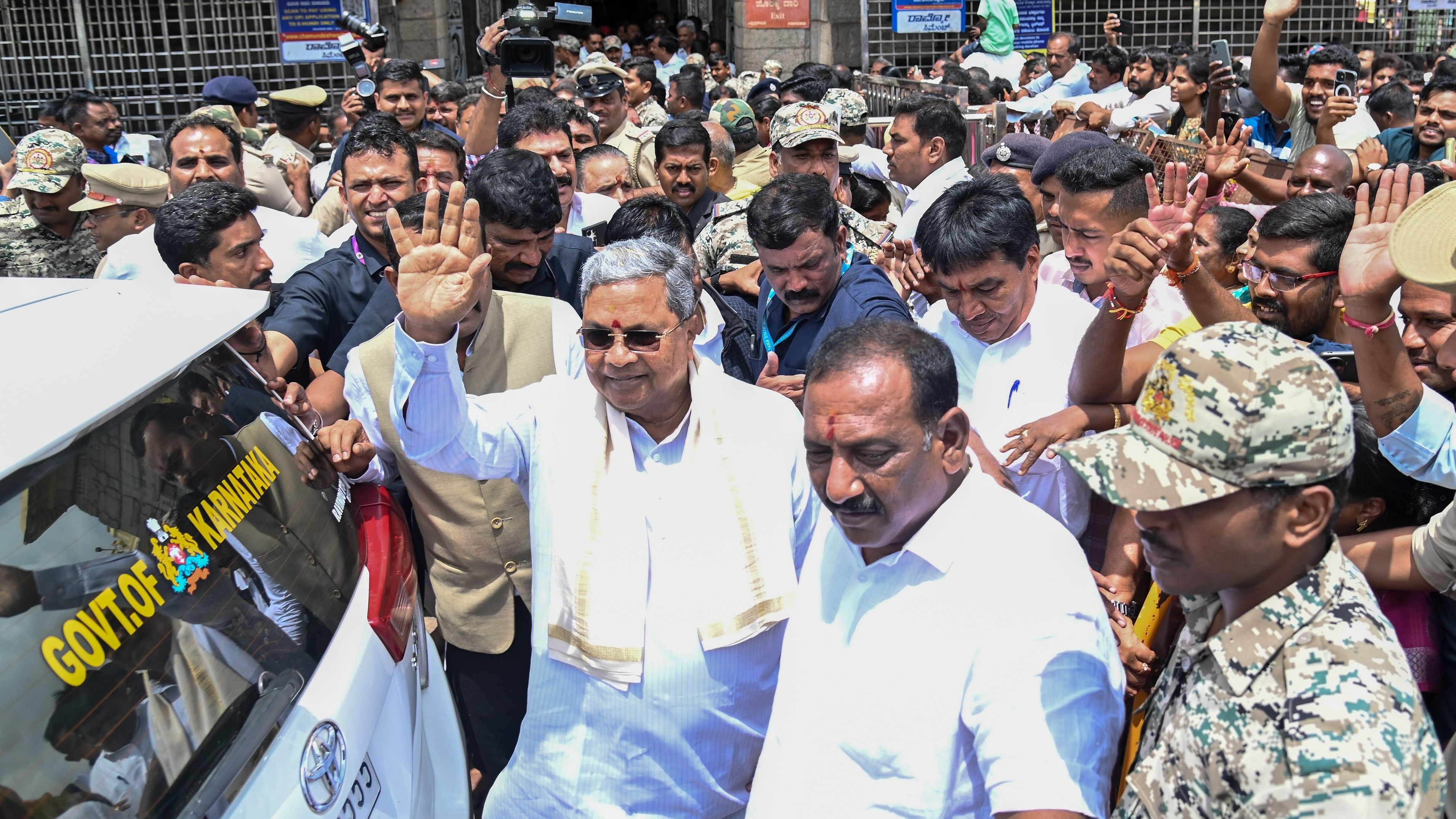 <div class="paragraphs"><p>Chief Minister Siddaramaiah waves at the crowd during his visit to Chamundeshwari Temple atop Chamundi Hill in Mysuru on Tuesday.</p></div>