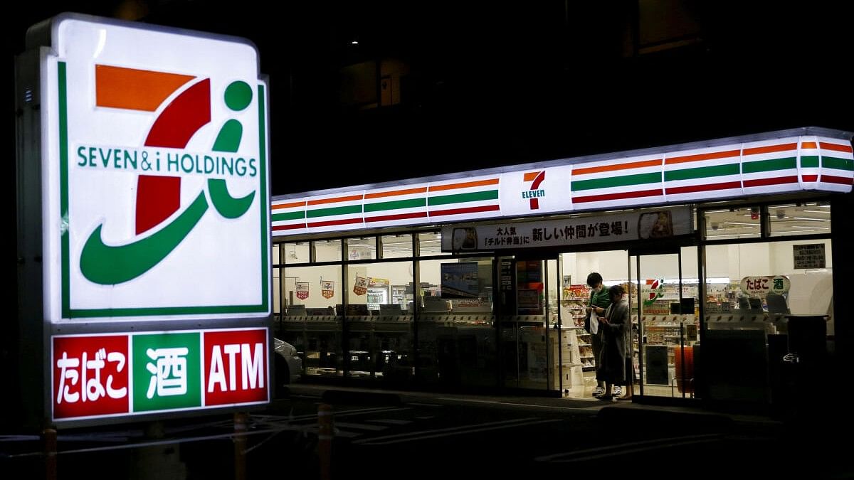 <div class="paragraphs"><p>Shoppers walk out from a Seven &amp; I Holdings' 7-Eleven convenience store in Tokyo, Japan.</p></div>