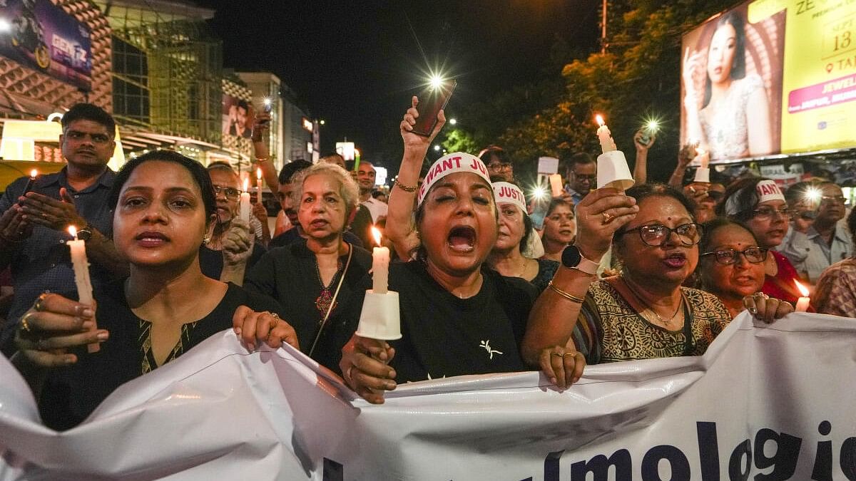 <div class="paragraphs"><p>People during a candlelight march in protest against the alleged rape and murder of a trainee woman doctor at the RG Kar Medical College and Hospital, in Kolkata, Wednesday, Sept. 4, 2024. </p></div>