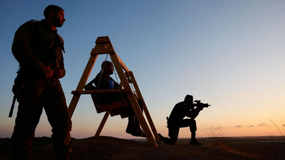 <div class="paragraphs"><p>Israeli soldiers watch Gaza during the sunset, near the Israel-Gaza border, amid the Israel-Hamas conflict, September 3, 2024</p></div>