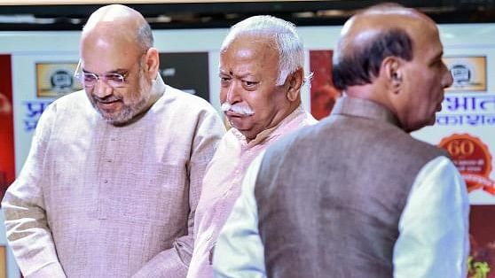 <div class="paragraphs"><p>BJP top brass Amit Shah with RSS head Mohan Bhagwat are seen here, Rajnath Singh can also be seen in the photo</p></div>