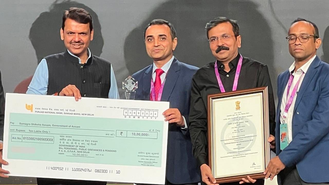 <div class="paragraphs"><p>Dr. Om Prakash, IAS, Mission Director and Shri Sanjoy Dutta, ACS, Executive Director from Samagra Shiksha, Assam receives the gold award from Maharashtra Deputy CM Devendra Fadnavis for e-governance for Shiksha Setu Axom App in the National Conference on e-Governance 2024, organized by Department of Administrative Reforms and Public Grievances.</p></div>