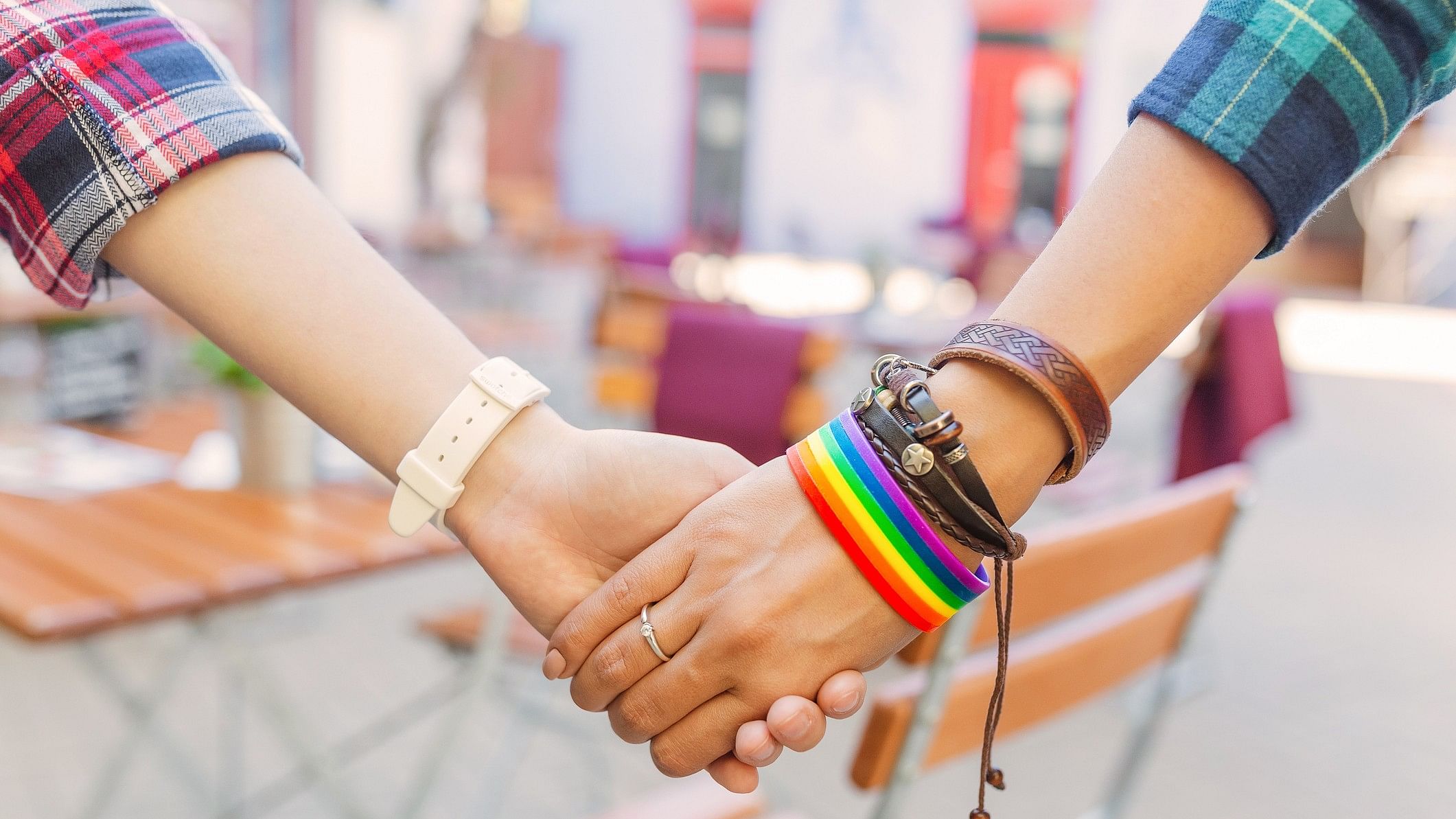 <div class="paragraphs"><p>Representative image showing a same-sex couple. Two women are seen holding hands in this image with a pride-coloured band visible</p></div>