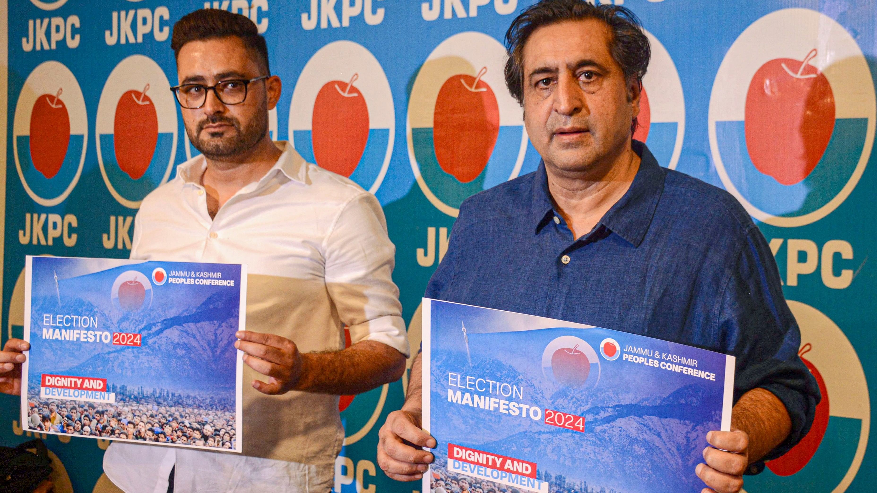 <div class="paragraphs"><p> Jammu and Kashmir People's Conference Chairman Sajad Lone along with party chief spokesperson releases the party manifesto ahead of the state assembly elections, in Srinagar, Thursday, September 5, 2024. </p></div>