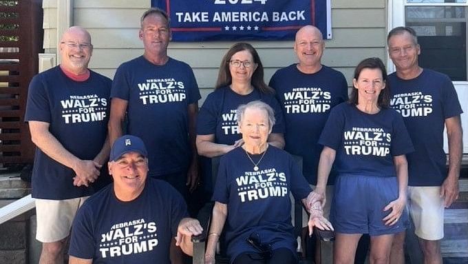 <div class="paragraphs"><p>Tim Walz’s family in Nebraska poses for a photo wearing custom Trump shirts. </p></div>