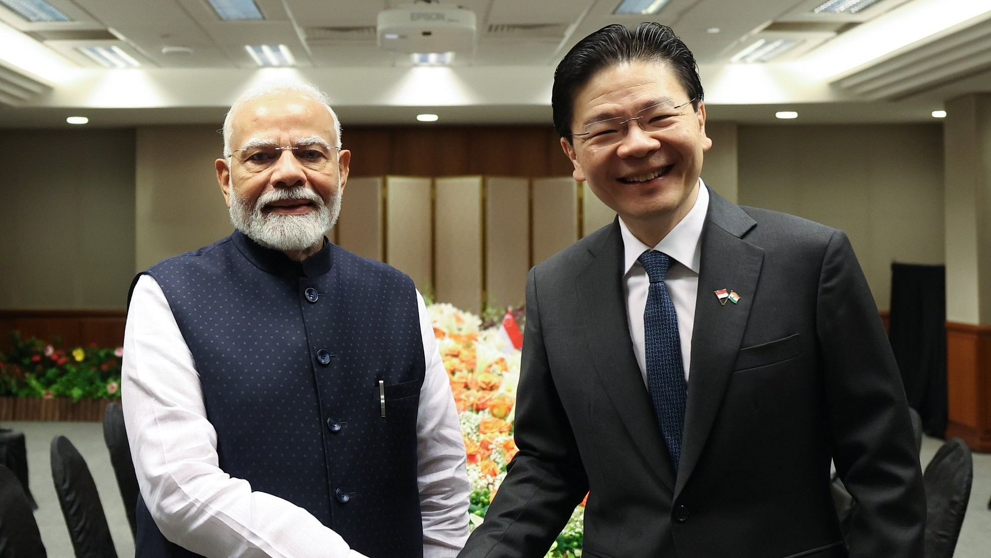 <div class="paragraphs"><p>Ahead of the talks with Wong, Modi received a red carpet-welcome at the Singapore Parliament House. He also signed the visitor's book there.</p></div>