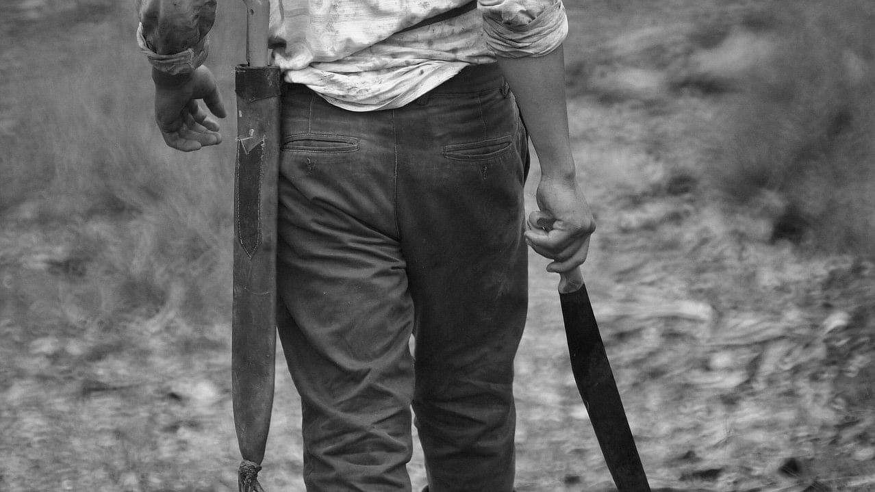 <div class="paragraphs"><p>Representative image showing a man with a&nbsp;machete.</p></div>