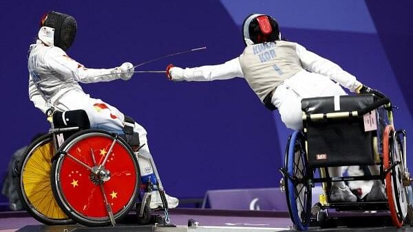 <div class="paragraphs"><p>Paris 2024 Paralympics - Wheelchair Fencing - Women's Foil Team - Quarterfinal - Grand Palais, Paris, France - September 5, 2024 Gu Haiyan of China in action against Kwon Hyo Kyeong of South Korea.</p></div>