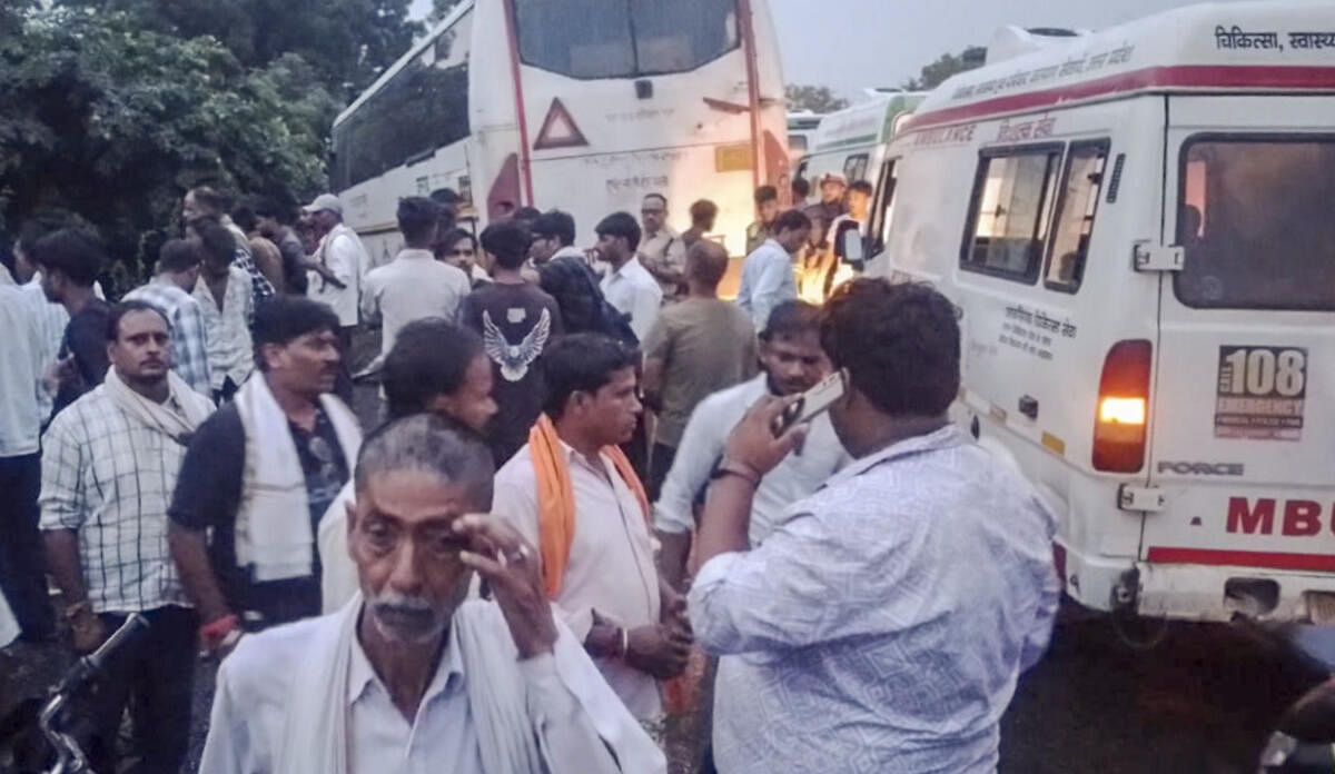 <div class="paragraphs"><p>People gather near the road accident site between a roadways bus and a van on National Highway 93, in Hathras district.</p></div>