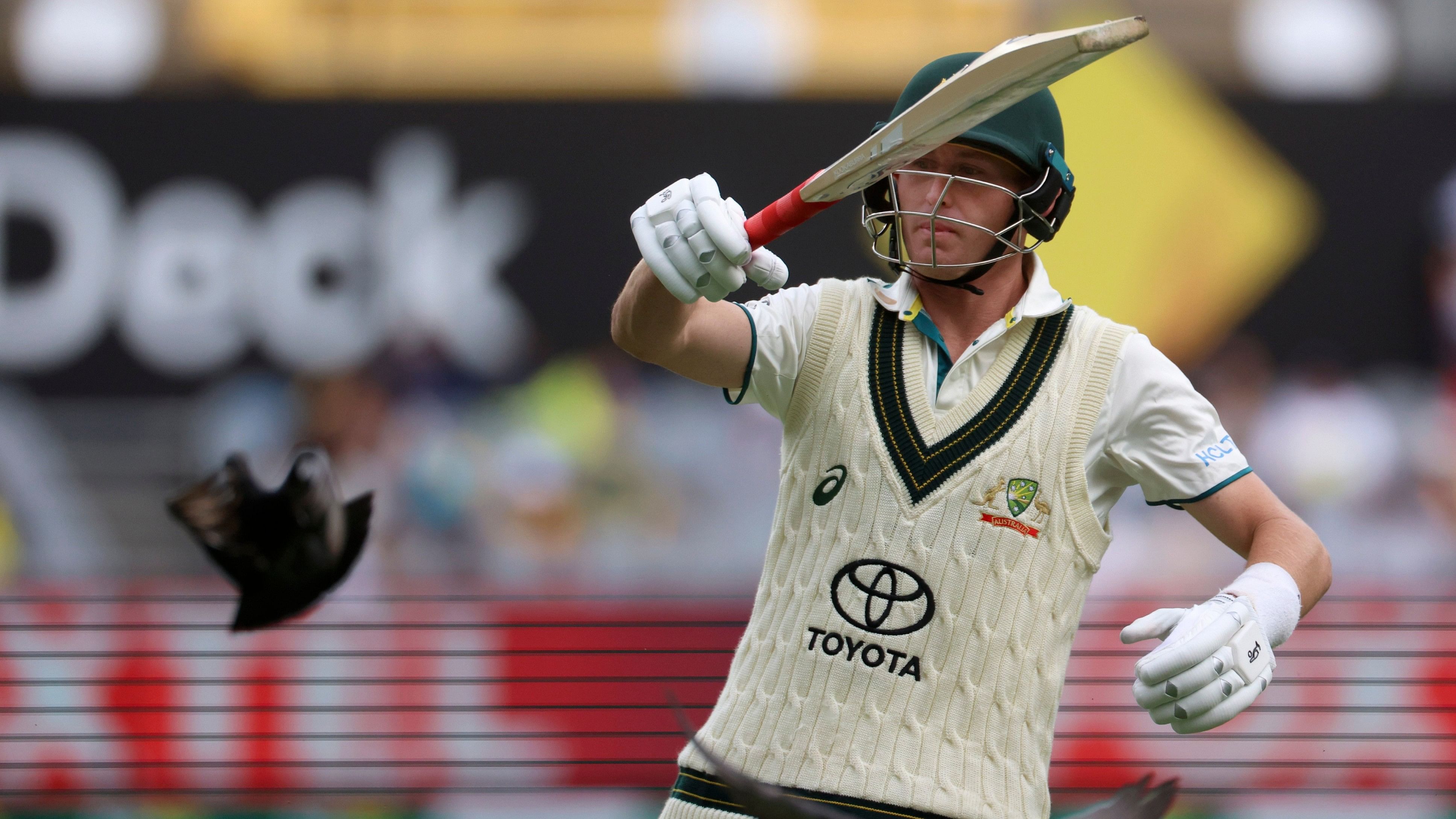 <div class="paragraphs"><p>Australia's Marnus Labuschagne chases pigeons off the field during a cricket test match</p></div>