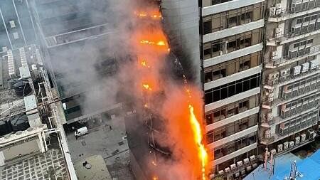 <div class="paragraphs"><p>Smoke and flame out after a fire broke out at Times Tower building in Kamala Mill compound, in Mumbai, Friday.&nbsp;</p></div>