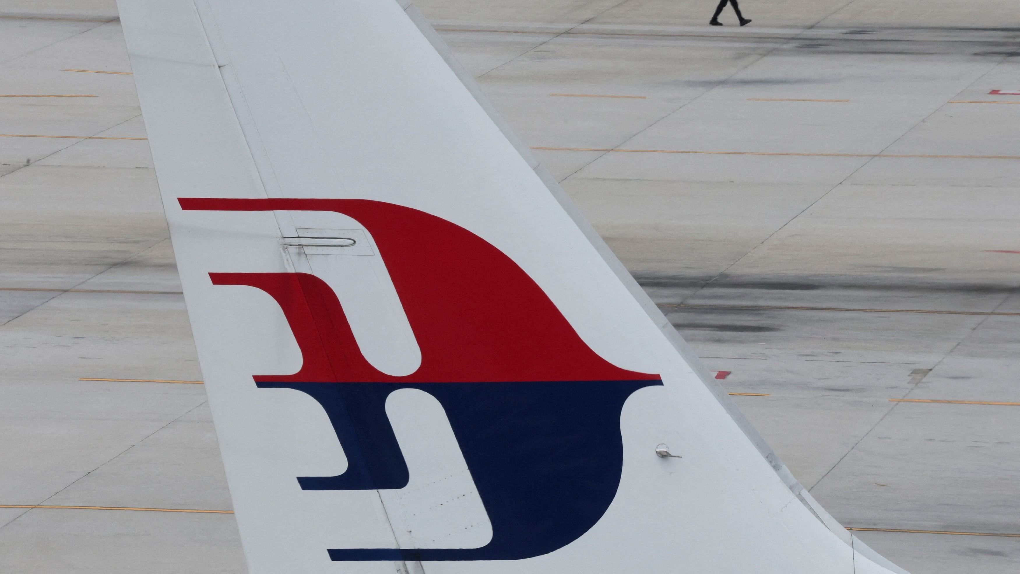 <div class="paragraphs"><p>The logo of Malaysia Airlines is seen on its plane parked at Kuala Lumpur International Airport in Sepang, Malaysia.</p></div>