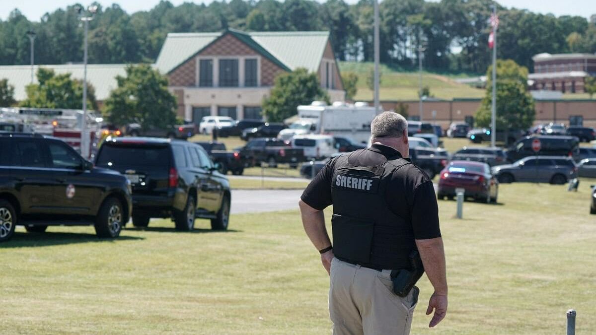 <div class="paragraphs"><p>A law enforcement officer works near the scene of a shooting at Apalachee High School in Winder, Georgia, US September 4, 2024.</p></div>