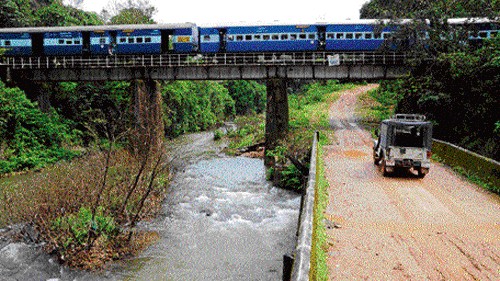 <div class="paragraphs"><p>The Yettinahole stream flows as the Mangalore - Bangalore train crosses the stream, near Marenahalli in Sakleshpur taluk of Hassan district.  </p></div>