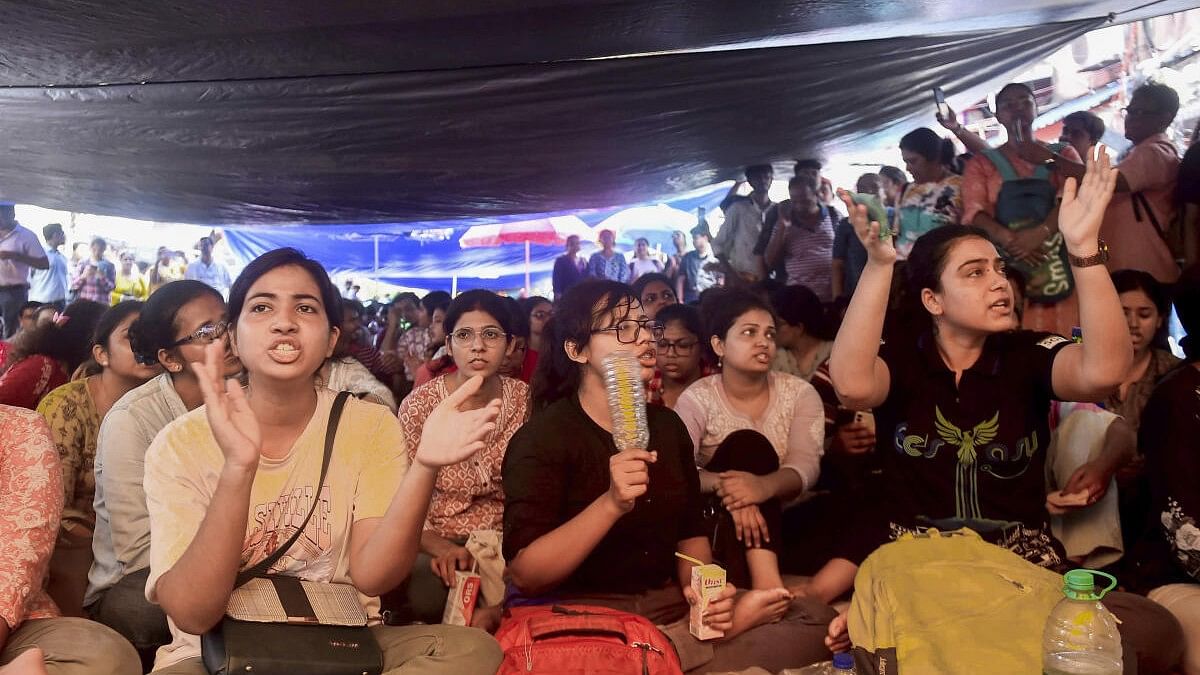 <div class="paragraphs"><p>Junior doctors stage a protest  over the sexual assault and murder of a trainee doctor, in Kolkata.</p></div>