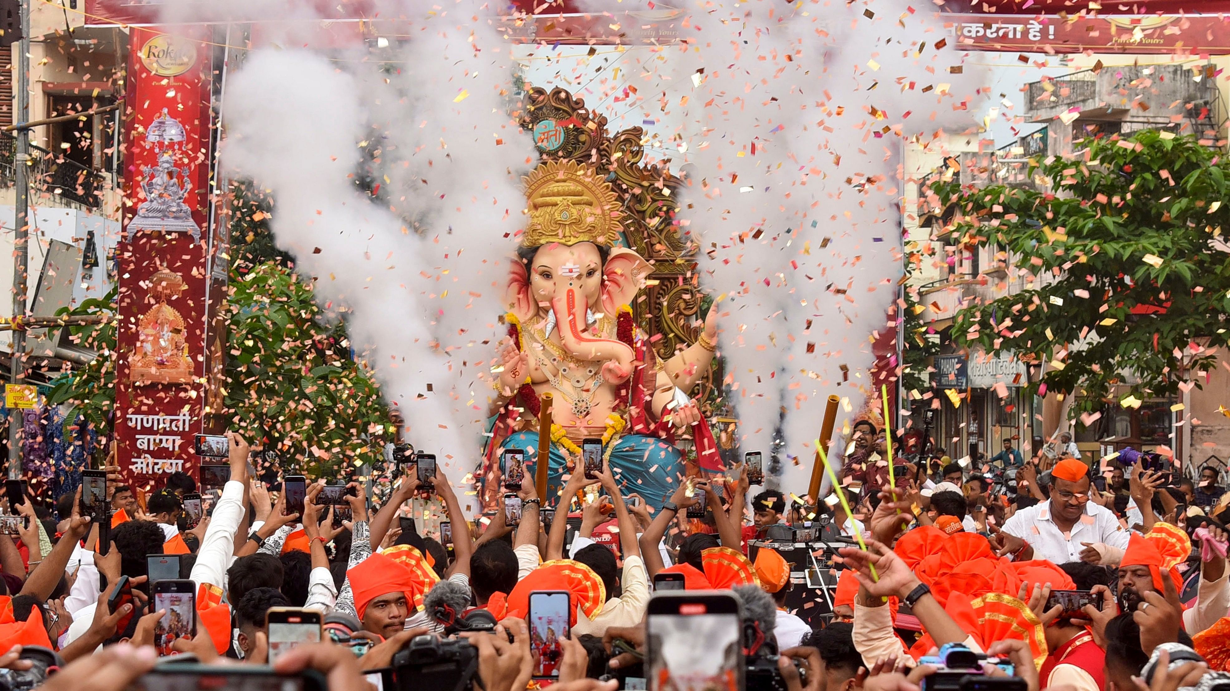 <div class="paragraphs"><p>Devotees carry an idol of Lord Ganesha to pandal during a procession on the eve of the Ganesh Chaturthi festival, in Nagpur.&nbsp;</p></div>