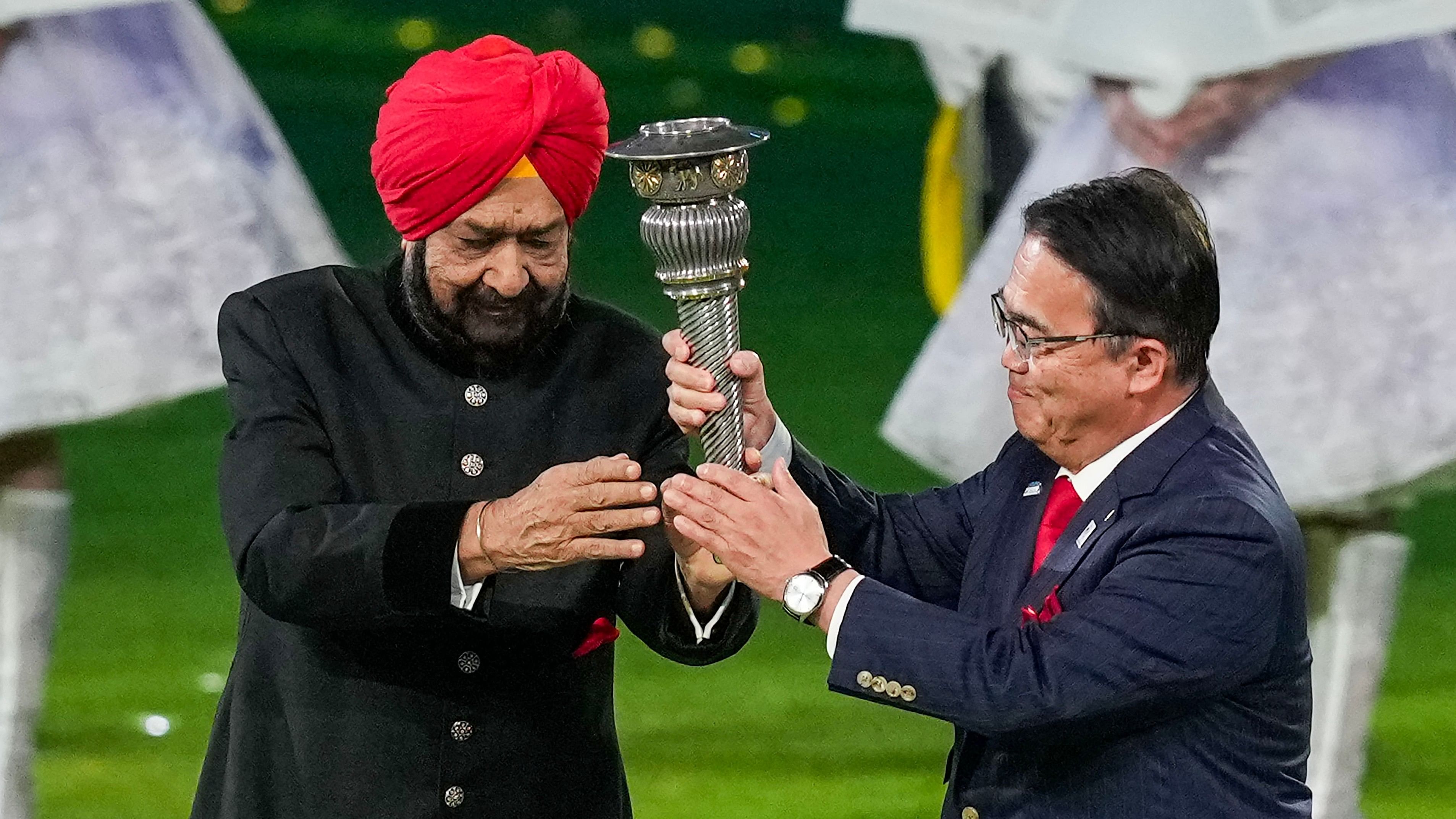 <div class="paragraphs"><p>Olympic Council of Asia (OCA) chief Randhir Singh with a Chinese representative during the handing over of 1st Asian Games' torch.&nbsp;</p></div>