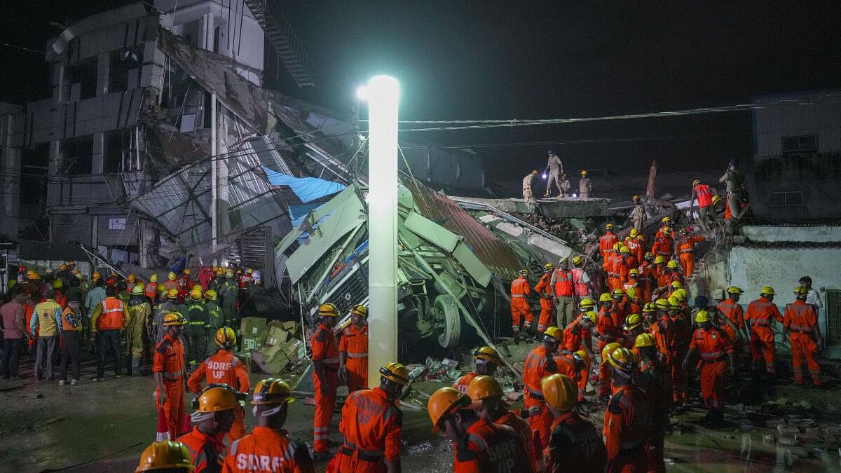 <div class="paragraphs"><p>SDRF personnel conduct a rescue operation after a three-storey building collapsed, at Transport Nagar area in Lucknow.</p></div>