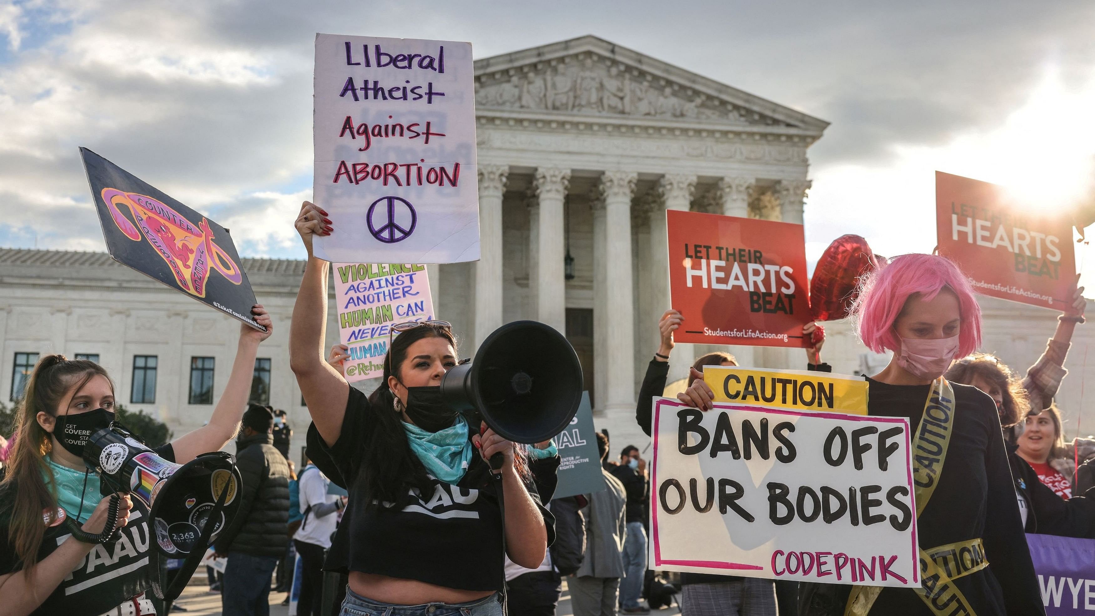 <div class="paragraphs"><p>Pro-choice and anti-abortion both demonstrate outside the United States Supreme Court as the court hears arguments over a challenge to a Texas law that bans abortion after six weeks in Washington, US.</p></div>