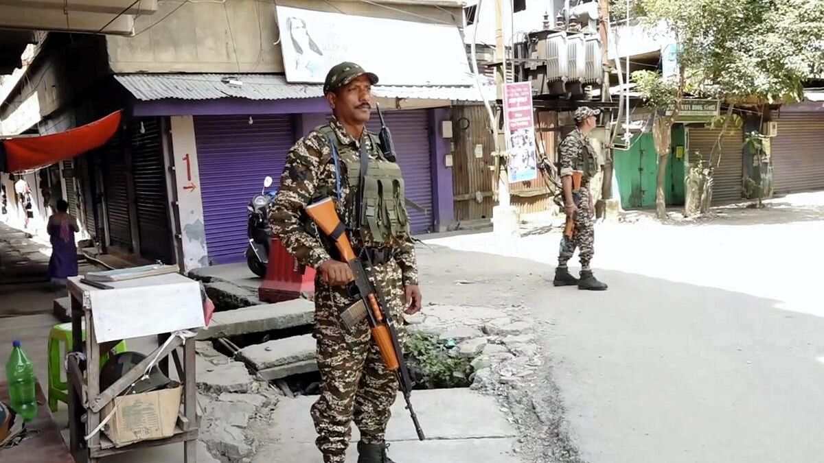 <div class="paragraphs"><p>Security personnel stand guard after a fresh violence, in Imphal, Sunday, Sept. 8, 2024.</p></div>