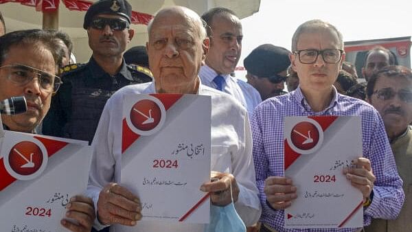 <div class="paragraphs"><p>National Conference President Farooq Abdullah with his son and party Vice President Omar Abdullah releases Urdu version of party election manifesto while paying tribute to his father and party founder Sheikh Muhammad Abdullah on his death anniversary, in Srinagar.&nbsp;</p></div>