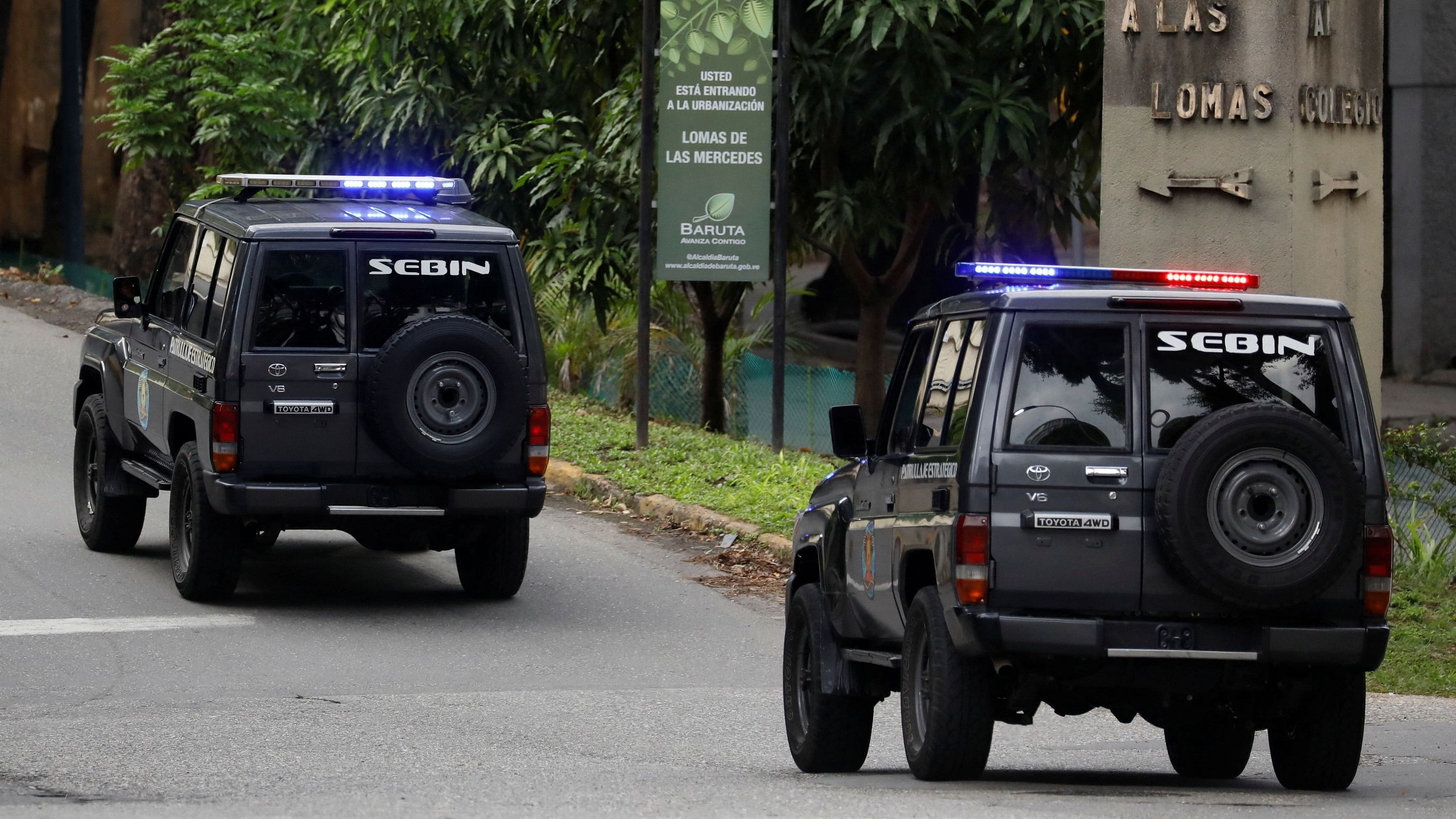 <div class="paragraphs"><p>Venezuelan intelligence and police forces stand outside the Argentine ambassador's residence, in Caracas</p></div>