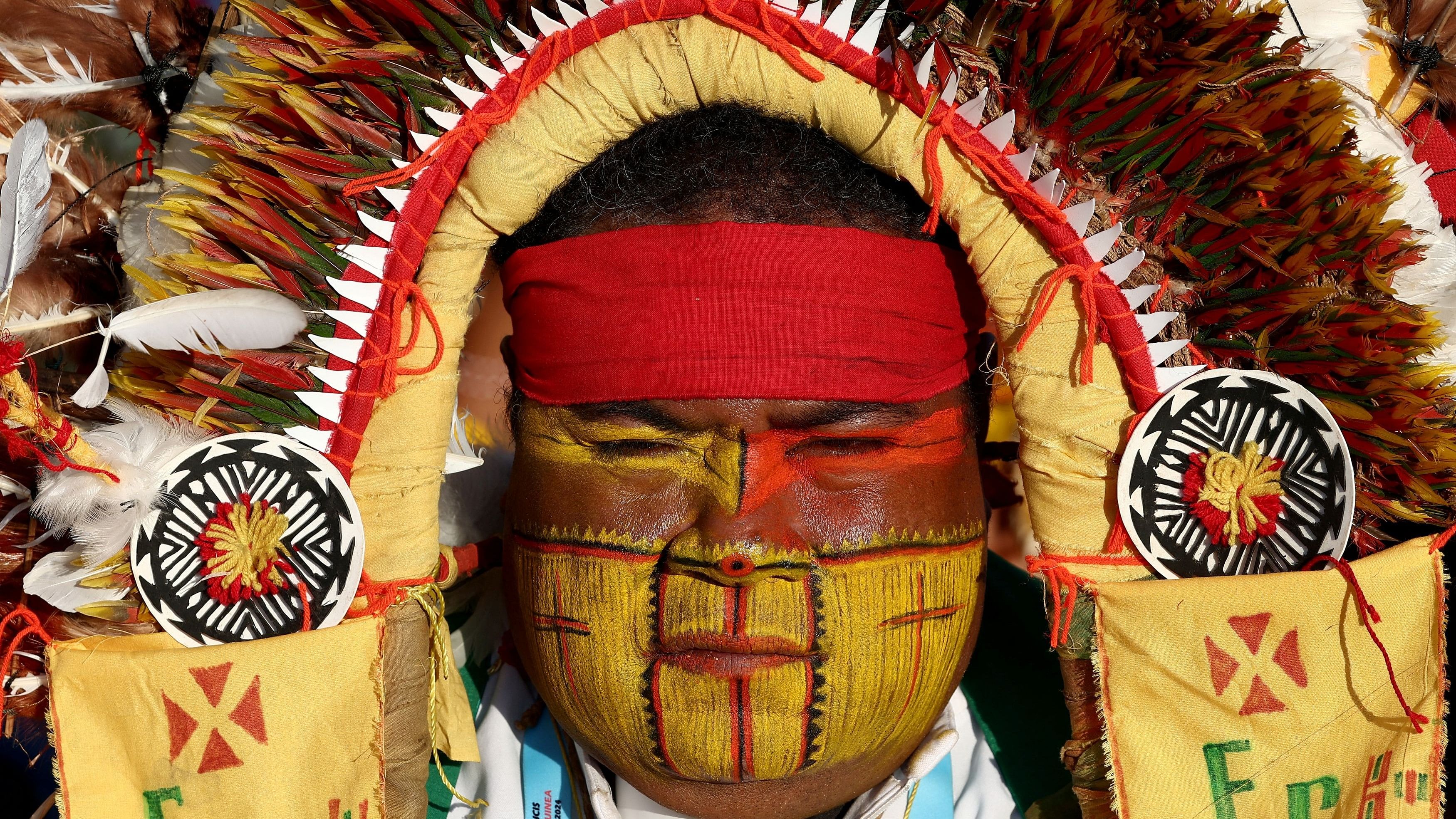 <div class="paragraphs"><p>Indigenous people wait for Pope Francis's arrival to attend the holy mass at the Sir John Guise Stadium in Port Moresby, Papua New Guinea, September 8, 2024</p></div>