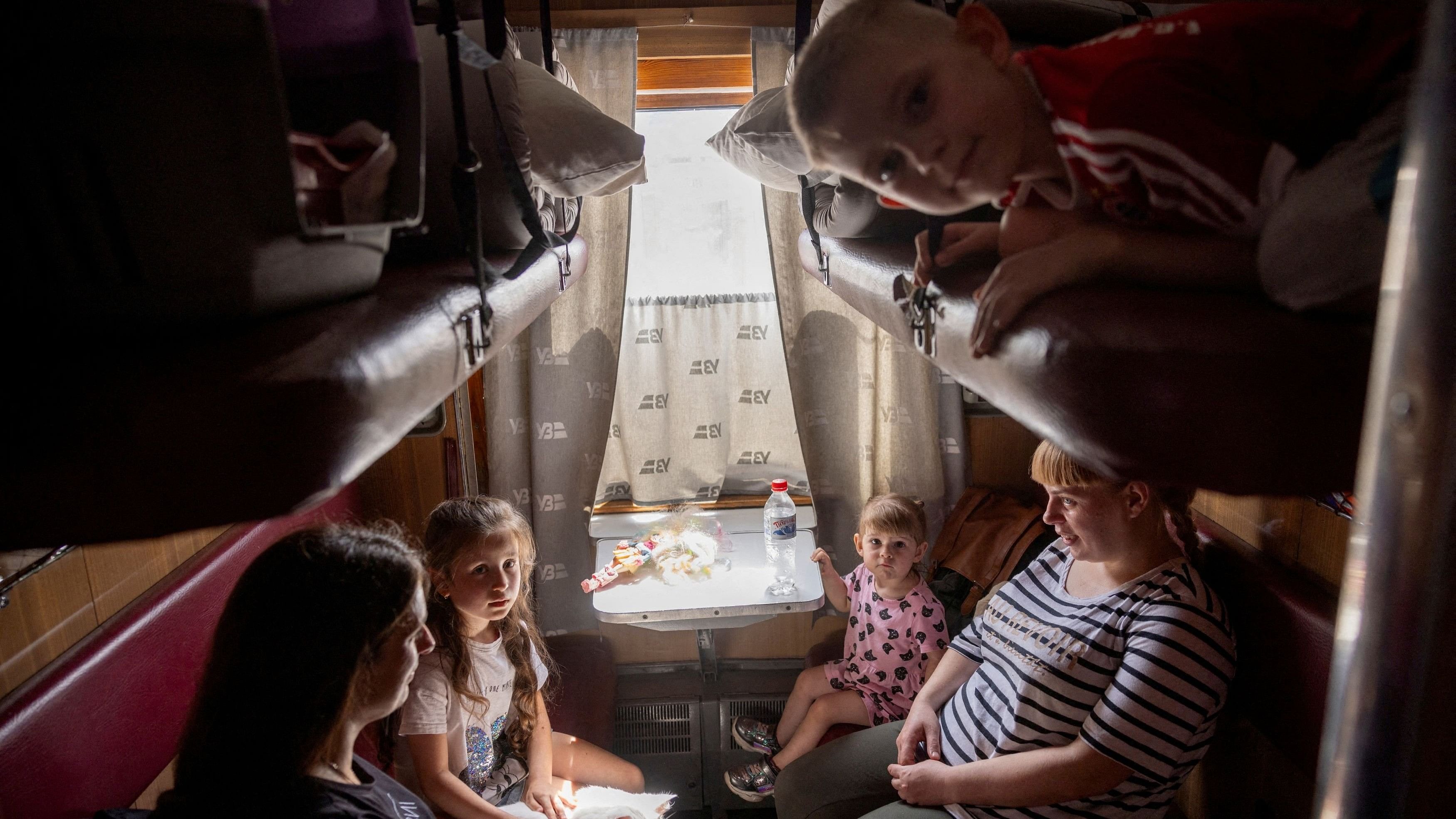 <div class="paragraphs"><p>A family sits on an evacuation train as they flee Russian troop advances, amid Russia's attack on Ukraine, in Pokrovsk, Ukraine, August 22, 2024.</p></div>